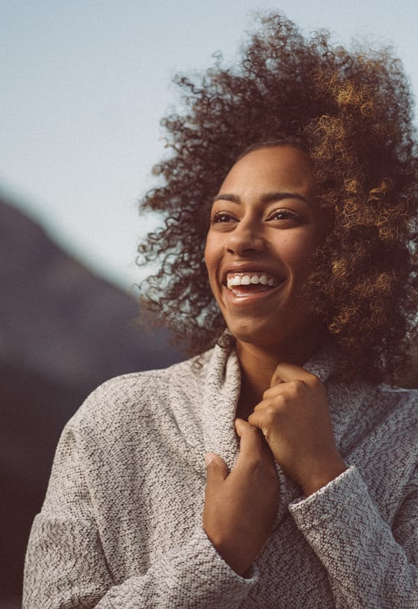 Smiling woman with curly hair