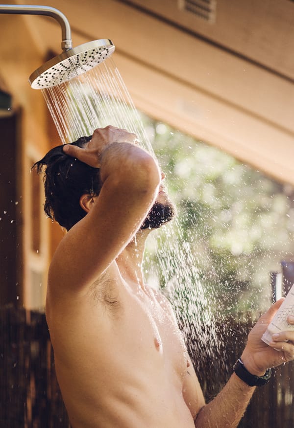 Man washing his hair in the shower